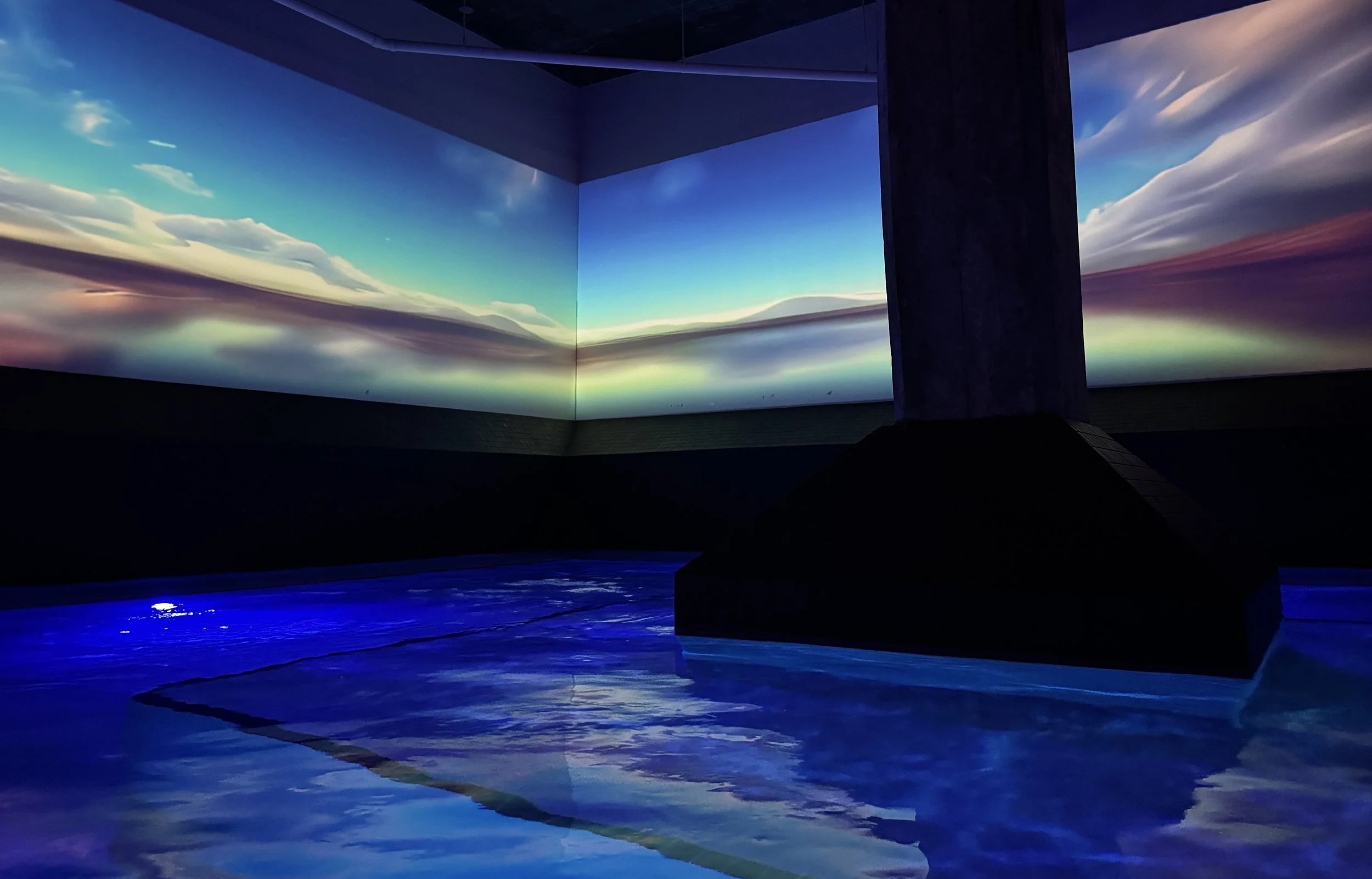 The subterranean bath hall with cosmic projections on the walls